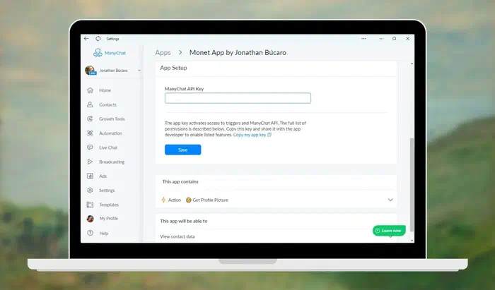 Background artwork by Monet with a laptop displaying the ManyChat app configuration screen for entering the API key.